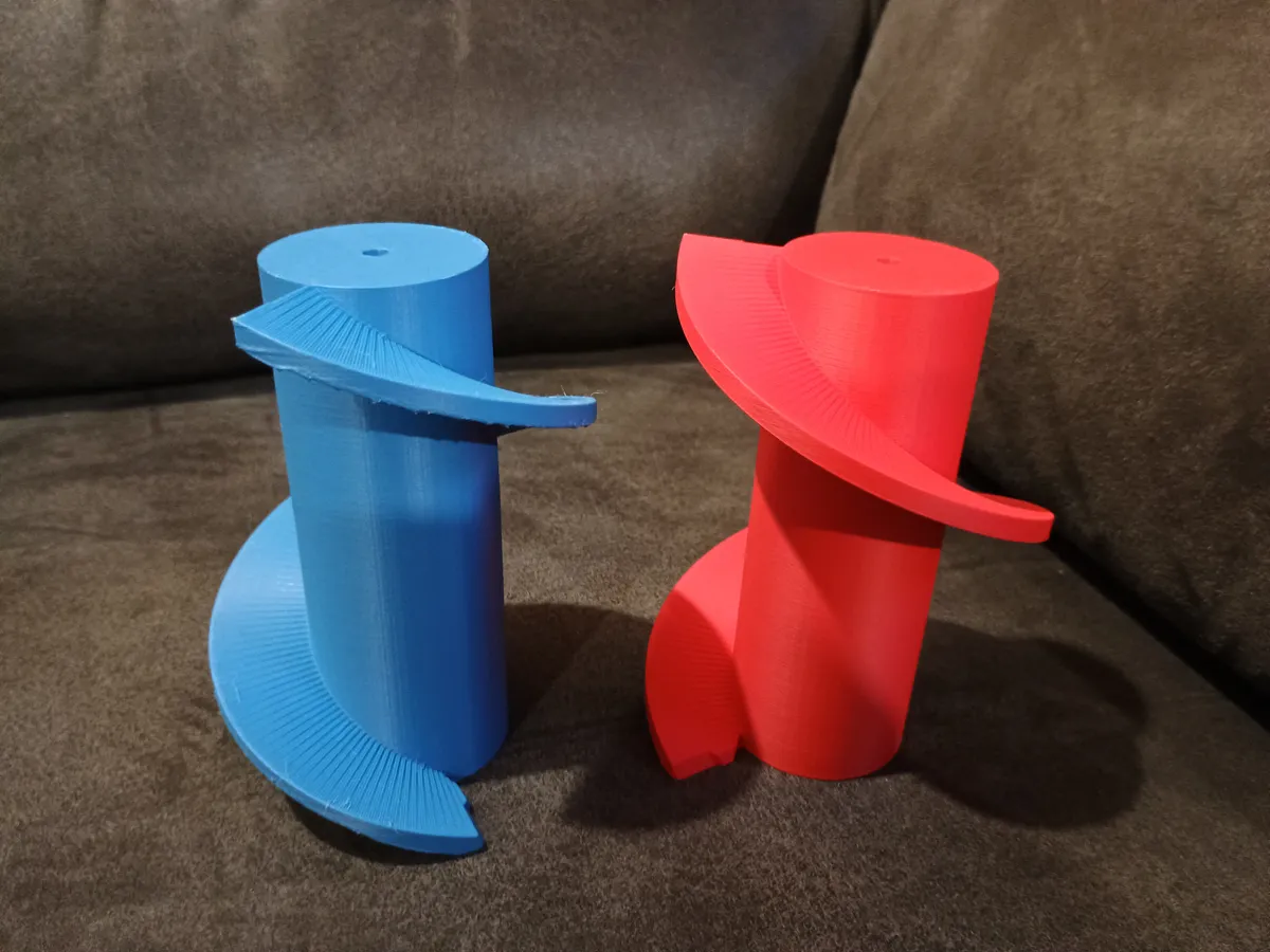 Two 3D-printed auger (screw) prototypes, one blue and one red